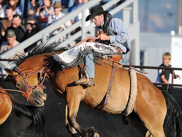 Chisholm Christensen of Hinsdale competes in the Saddle Bronc Riding event on Friday evening in Columbia Falls. Christensen scored a 67 on this run and of three competitors he was the only one to advance on to the competition on Saturday night.