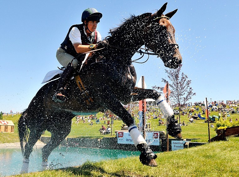 Maley Coombs rides Land Hope out of the pond while running the Cross-Country in the Advanced division at The Event Saturday afternoon.