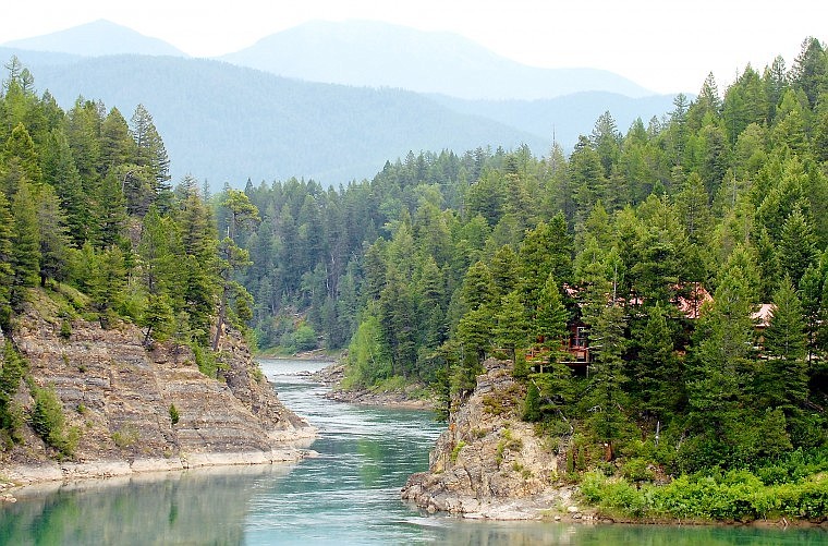 A proposed 16-foot-wide, 325-foot-long private bridge over the Flathead River near Hungry Horse would be put next to Craig and Susan Drynan&#146;s home at right.