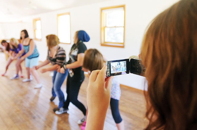 &lt;p&gt;Former attendee Vanessa Naive, right, films a mimed tug-of-war match July 23 during the Share Your Voice Foundation's Empowerment Through Performance Workshop at the Bohemian Grange south of Whitefish.&lt;/p&gt;