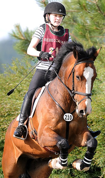 Carly Alexander-Lees of Seattle, Wash., rides Highlander in the Junior Open Novice B competition on Friday morning at the Event at Rebecca Farm.