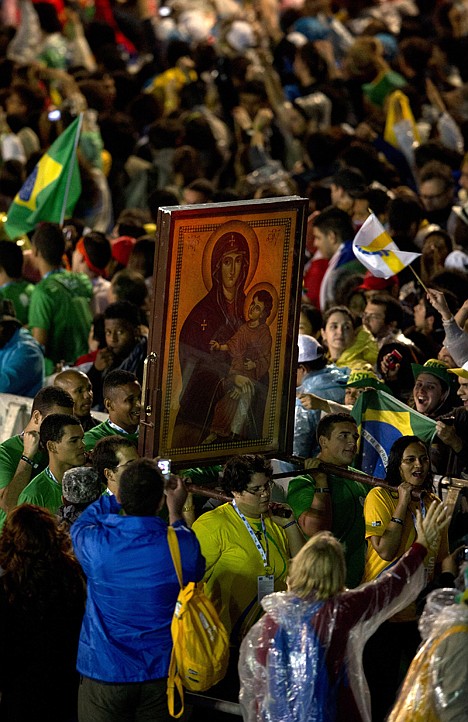 &lt;p&gt;Pilgrims carry one of the World Youth Day symbols, an Icon of Our Lady, before the start of a Mass at Copacabana beach, in Rio de Janeiro, Brazil, Tuesday. As many as 1 million young people from around the world are expected in Rio for the Catholic youth event.&lt;/p&gt;