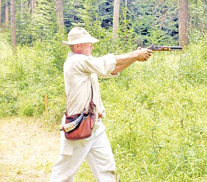 &lt;p&gt;Dean Thompson fires a pistol at targets downrange.&lt;/p&gt;