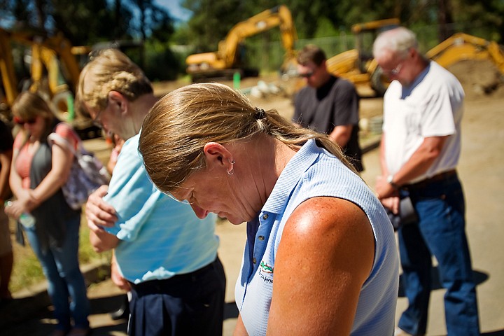 &lt;p&gt;Kathryn French takes part in a dedication prayer Friday at the site of her future home at the Hamilton Woods Habitat for Humanity site in Coeur d'Alene.&lt;/p&gt;