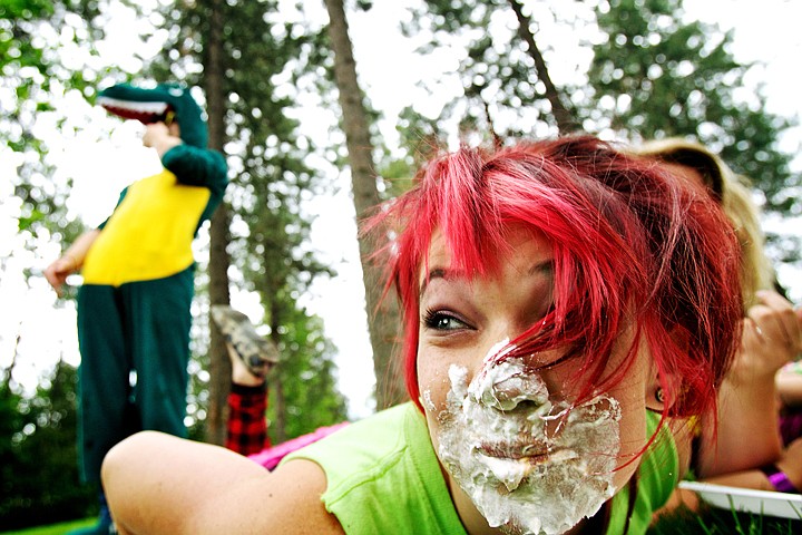 &lt;p&gt;JEROME A. POLLOS/Press McKayla Braddy, 15, looks down the line of competitors in the whip cream eating competition after Brandon Karges, 16, dressed in his dinosaur costume, finished his plate Thursday during Special Need Recreation's &quot;crazy day&quot; outing at Fernan Elementary. Staff members and volunteers joined summer campers in costumes and wild make-up to participate in games and activities.&lt;/p&gt;