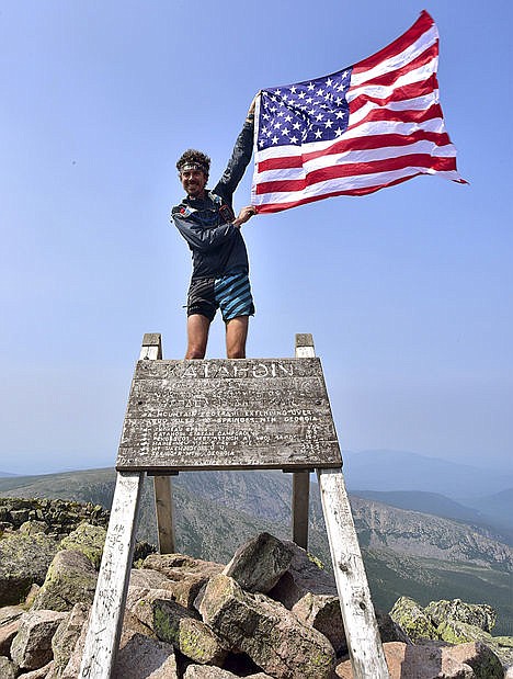 &lt;p&gt;Scott Jurek celebrates atop Mount Katahdin near Millinocket, Maine, after completing the Appalachian Trail in what he claims is record time, July 12.&lt;/p&gt;