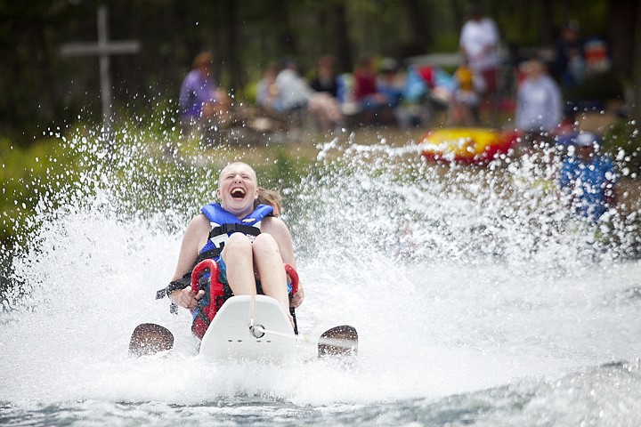 &lt;p&gt;James Howe, a participant in the DREAM Adaptive Recreation
program, laughs as he is pulled up out of the water on a waterski
chair on Peterson Lake Wednesday afternoon.&lt;/p&gt;