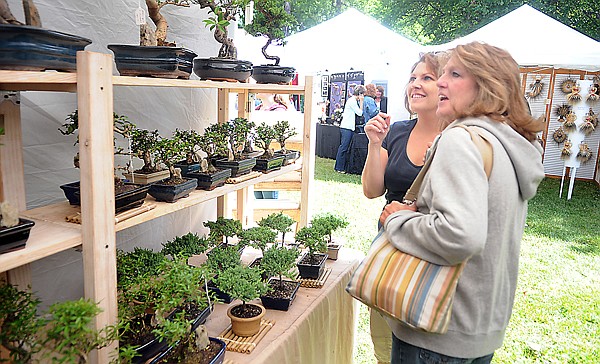 &lt;p&gt;Chelsea Burns of Kalispell, and her mother, Bobbie Burns of
Lakeside, check out bonsai trees at the New Country Bonsai Garden
Inc. display on Friday at Arts in the Park in Kalispell. New
Country Bonsai, which operates out of California, is attending Arts
in the Park for the first time this year.&lt;/p&gt;