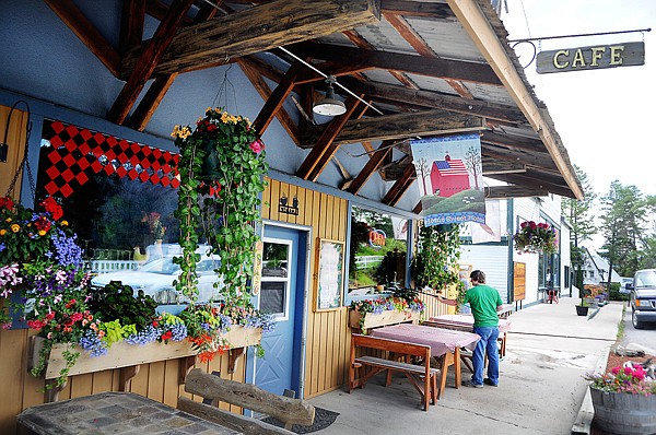 &lt;p&gt;Kyler Commers, 17, waters the plants outside the Somers Bay Cafe
on Friday morning.&lt;/p&gt;