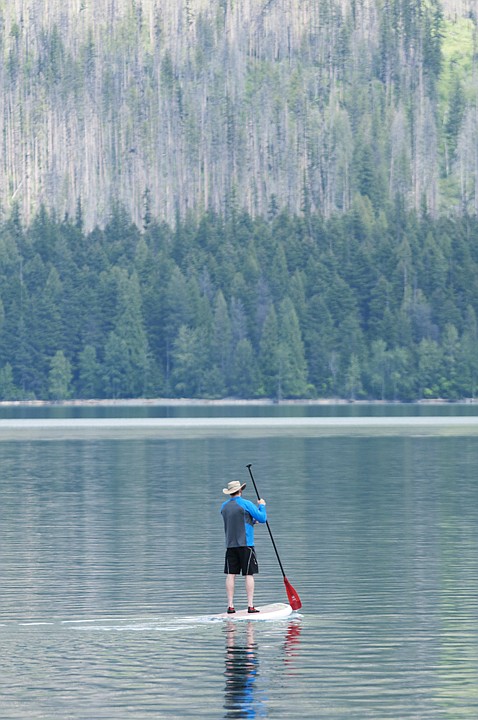 &lt;p&gt;Brian Davis rides a stand-up paddle board on Lake McDonald in
Glacier National Park Thursday morning. Davis, originally from
Kalispell, lives in California but says he tries to make it back to
the park every summer.&lt;/p&gt;