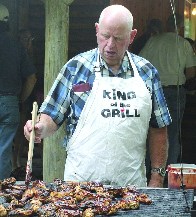 &lt;p&gt;Don Burrell of the Community Christians Men's Prayer Group marinates the grilled chicken with barbecue sauce at the annual jamboree.&lt;/p&gt;