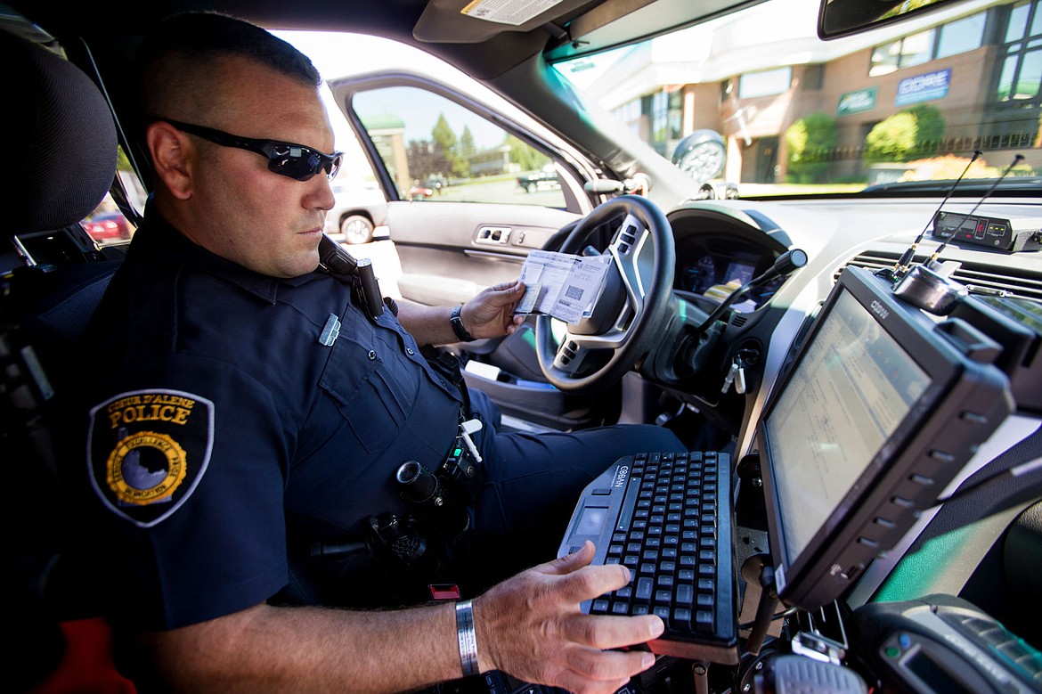 &lt;p&gt;JAKE PARRISH/Press After pulling a driver over for speeding, Coeur d'Alene Police Traffic Officer Josh Sterling checks the status of the driver's vehicle registration and driving record using the computer in his police vehicle on Thursday.&lt;/p&gt;