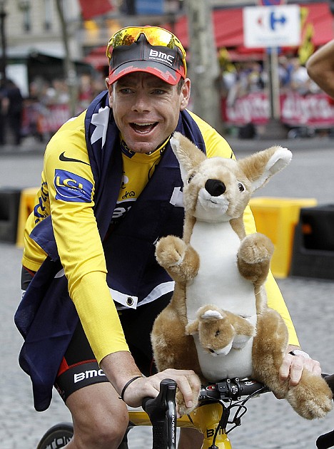 &lt;p&gt;Tour de France winner Cadel Evans of Australia, wearing the overall leader's yellow jersey, cycles down the Champs Elysees during the victory parade after winning the Tour de France on Sunday in Paris.&lt;/p&gt;