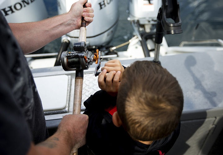 &lt;p&gt;Collin Rzepa helps his father Jason reel in a Kokanee salmon on Friday on Lake Pend Orielle.&#160;Boats for Heroes, the non-profit founded by Vietnam veteran Keith Mathewsand his wife Cathy, takes veterans and their familes out on free fishing trips in Washington and Idaho.&#160;&lt;/p&gt;