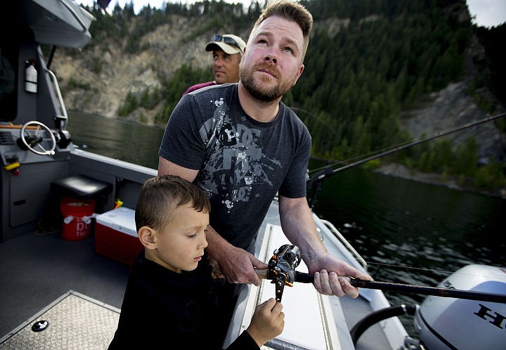 &lt;p&gt;JAKE PARRISH/Press Army veteran and Purple Heart recipient Jason Rzepa and his 5-year-old son Collin reel in a Kokanee salmon together on Friday during a fishing trip put on by Boats for Heroes on Lake Pend Orielle. Boats for Heroes, founded by Vietnam veteran Keith Mathews and his wife Cathy, takes veterans and their families out on free fishing trips in Washington and Idaho.&lt;/p&gt;