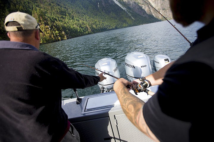 &lt;p&gt;Army National Guard veteran Justin Coons, left, guides in a fishing line managed by Guard veteran Ryan Rogers as they bring in a Kokanee salmon during a Boats for Heroes fishing trip on July 22, 2016 on Lake Pend Orielle. Boats for Heroes, the non-profit founded by Vietnam veteran Keith Mathews and his wife Cathy, takes veterans and their families out on free fishing trips in Washington and Idaho.&lt;/p&gt;