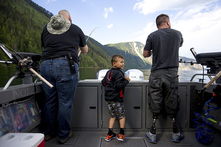 &lt;p&gt;JAKE PARRISH/Press Collin Rzepa, five, excitedly waits as his father Jason, right, and Ryan Rogers to reel in fish on Friday on Lake Pend Oreille while on a fishing trip put on by Boats for Heroes. Rzepa and Rogers served in Iraq together, where Rzepa lost his legs in an IED explosion that took the lives of two American soldiers.&lt;/p&gt;