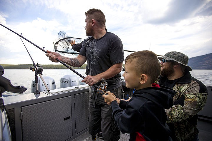 &lt;p&gt;Collin Rzepa wrangles in a Kokanee salmon as his father Jason, left, and Ryan Rogers help during a Boats for Heroes fishing trip on July 22, 2016 on Lake Pend Orielle.&#160;Boats for Heroes, the non-profit founded by Vietnam veteran Keith Mathews and his wife Cathy, takes veterans and their families out on free fishing trips in Washington and Idaho.&#160;&lt;/p&gt;