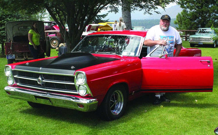 &lt;p&gt;John Hamill stands by his 1966 Ford Fairlane at the Tenth Annual Cool Summer Nites Car, Truck and Bike Show over the weekend.&lt;/p&gt;