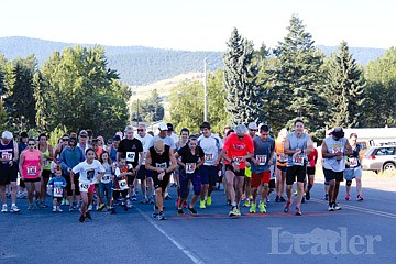 <p>Runners take off from the starting line during the 8:00 races of the Buffalo Run.</p>