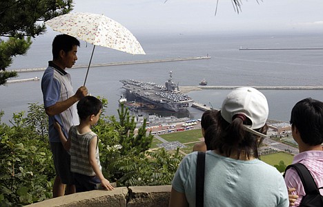 &lt;p&gt;South Koreans on a hilltop park look at the U.S. nuclear-powered aircraft carrier USS George Washington at the Busan port in Busan, south of Seoul, South Korea.&lt;/p&gt;