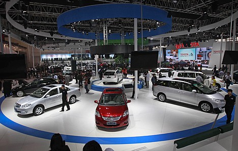 &lt;p&gt;FILE - In this April 23, 2012 file photo, Toyota cars, including Vios, center, are on display at the Beijing International Auto Exhibition in Beijing before China's biggest auto show opens to the public on April 27. Toyota said Wednesday, July 25, it sold 4.97 million vehicles globally for the first six months of this year, a strong result that could see the Japanese automaker regain its crown as the world's top automaker from General Motors Co. (AP Photo/Vincent Thian, File)&lt;/p&gt;