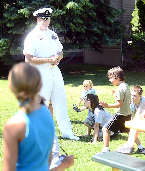 <p>Master Chief Petty Officer Robert Stout plays "Night at the Museum" with children from the Boys and Girls Club on Wednesday afternoon, July 25, in Columbia Falls. (Brenda Ahearn/Daily Inter Lake)</p>