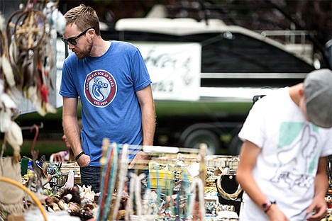 &lt;p&gt;Matt Johnstun examines a table of a vendor&#146;s various items during Hayden Days Saturday.&lt;/p&gt;