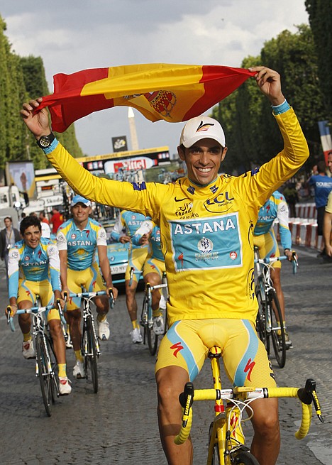 &lt;p&gt;Three-time Tour de France winner Alberto Contador of Spain holds aloft the Spanish national flag during a victory lap with his Astana teammates Sunday in Paris.&lt;/p&gt;