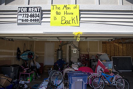 &lt;p&gt;Gina Abbott posted signs on her house and down the block welcoming back her husband, Staff Sgt, Chris Abbott, who returned home from Afghanistan after a nine-month deployment.&lt;/p&gt;