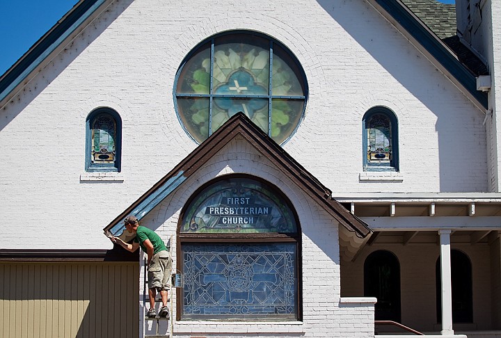 &lt;p&gt;Justin Taylor, painter with Partenfelder Paints, puts a fresh coat of brown on the trim work First Presbyterian Church in Coeur d'Alene Monday while making the finishing touches to a recent remodel of the downtown sanctuary.&lt;/p&gt;