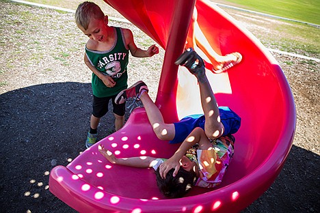 &lt;p&gt;Chance Vanhyning, 6, and Quinn Owen, 8, play on the slide at Seltice Elementary where the Kootenai County Boys and Girls club has lunch during the summer time when school is not in session.&lt;/p&gt;