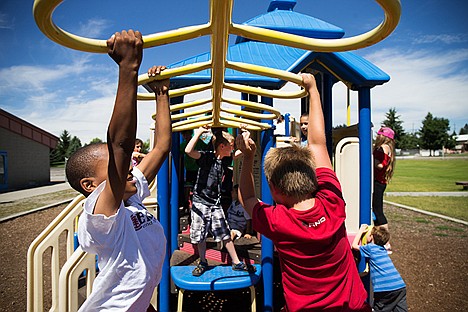 &lt;p&gt;Conner Lime, 9, and Gerad Myers, 9, swing from the monkey bars during lunch time at the Kootenai County Boys and Girls Club. Conner and Gerad have been friends for two years and met at the boys and girls club while playing sproutball. &#147;We always jinx each other,&#148; Gerad said.&lt;/p&gt;