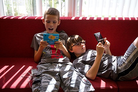 &lt;p&gt;Kole Poge, 11, left, and Elwin Hanson, 11, play Nintendo before lunch time in the Kootenai County Boys and Girls Club&#160;on Wednesday morning.&lt;/p&gt;