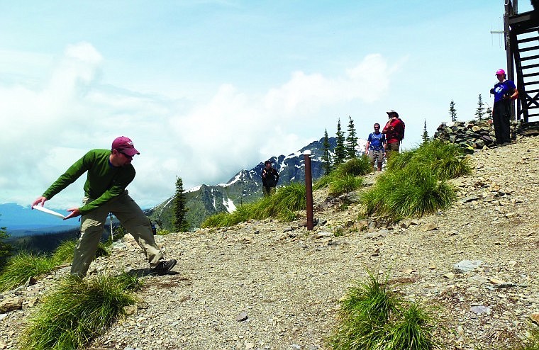 &lt;p&gt;A young man catches a frisbee at the Numa Lookout while Wes
Knutson and George Scherman look on.&lt;/p&gt;