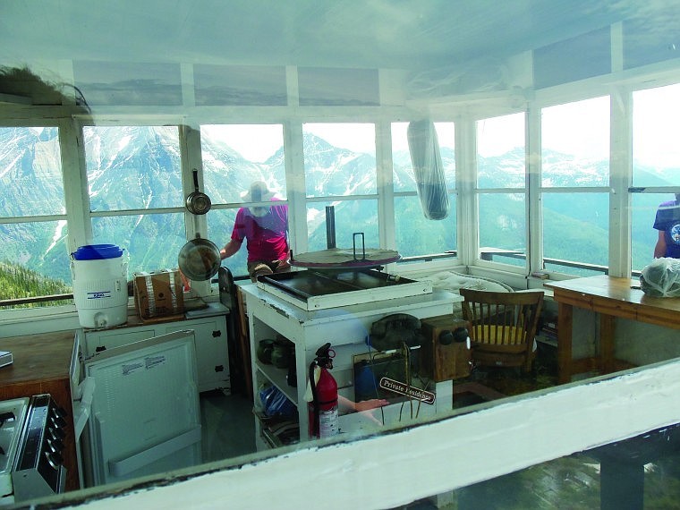 &lt;p&gt;George Scherman looks through the window of the unoccupied Numa
Ridge Lookout.&lt;/p&gt;