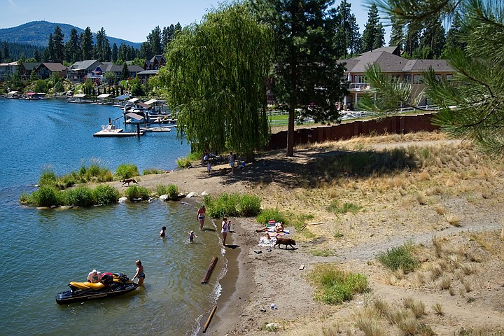 &lt;p&gt;Beach-goers gather at the shore of along the Spokane River near Maplewood Avenue in Post Falls. The 2.2 acre section of land, owned by the Bureau of Land Management, will be the topic of public discussion at Post Falls City Hall Wednesday at 6 p.m.&lt;/p&gt;