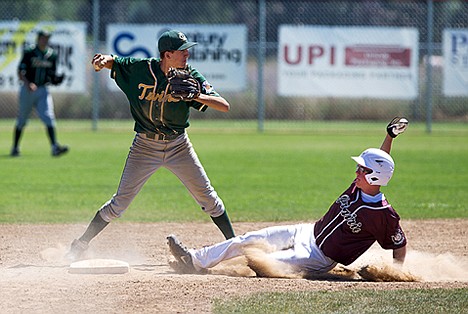 &lt;p&gt;American Legion Prairie Cardinal&#146;s Michael Bodak slides into second base and is tagged out by the Lewiston Clarkson Titans second baseman Tyler Gay in the eighth inning of the District AA Area A tournament championship game.&lt;/p&gt;