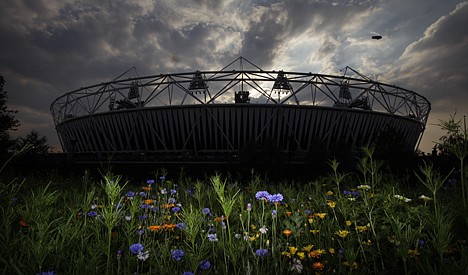 &lt;p&gt;A blimp flies in the sky as the sun sets behind the Olympic Stadium at the 2012 Summer Olympics, Wednesday in London.&lt;/p&gt;