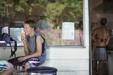 &lt;p&gt;Kyle Peabody, 11, enjoys an ice cream cone at Creamery and Fudge Factory Thursday during a family visit to Harrison.&lt;/p&gt;