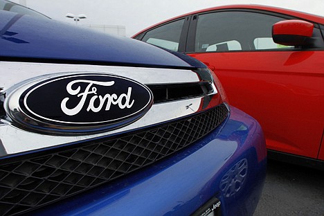 &lt;p&gt;The Ford logo is seen on cars for sale at a Ford dealership in Springfield, Ill., on July 1. Ford is recalling nearly 485,000 Escapes and Mavericks to fix sticking gas pedals that can cause crashes.&lt;/p&gt;