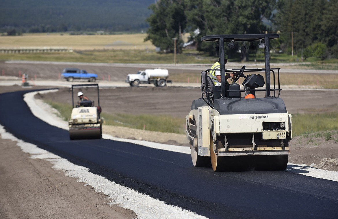 &lt;p&gt;Rollers compact the asphalt plant mix on the bike path on the side of the U.S. 93 Bypass near Four Mile Road on Wednesday. (Aaric Bryan/Daily Inter Lake)&lt;/p&gt;