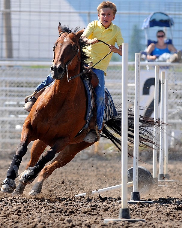 Cooper Kohr rides between the poles Wednesday on his horse Ranger.