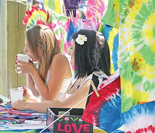 &lt;p&gt;Peace, love and snacks: Ashley Courville and Sydney Allard grab
a bite while manning the Make-A-Wish table.&lt;/p&gt;