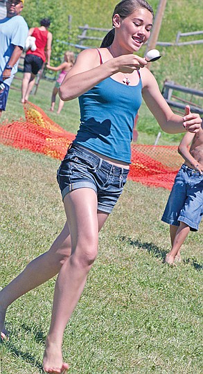 &lt;p&gt;A competitor in the egg-balance race, Kazlyn Roullier makes her
way across the field quickly but carefully.&lt;/p&gt;