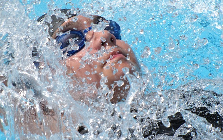 Danika Whitcomb competes in the backstroke at the divisional meet.