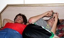 Josh and Justin Evertz relax in their hotel room in between games.