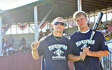 Tim Rausch and Derrick Rathe pose for a picture at the district tournament.