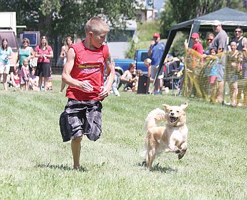 &lt;p&gt;Warren Castor of St. Ignatius, and his dog, Stormi, barrel toward the finish in the dog races.&lt;/p&gt;