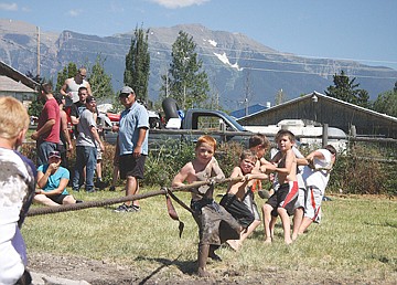 &lt;p&gt;On the edge of the mud pit, Bryce Umphrey, center, leads his team to victory in the tug-of-war.&lt;/p&gt;